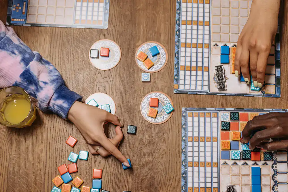 Designers reviewing game board drafts
