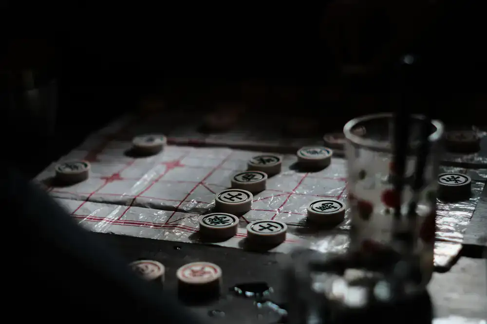 Subtle dark geometric grid representing a tactical game board